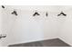 Empty walk in closet with a single shelf and black hangers on a gray carpet at 620 Devon Aly, Acworth, GA 30102