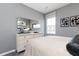 A bedroom with a large window and a dresser against a light gray wall at 624 Devon Aly, Acworth, GA 30102