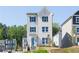 Charming two-story home with a combination of white brick and gray siding, complemented by a bright blue front door at 624 Devon Aly, Acworth, GA 30102