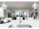 Bright, open-concept kitchen with stainless steel faucet and views of dining and living areas at 624 Devon Aly, Acworth, GA 30102