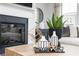 Modern living room with a fireplace, decorative vases, and stylish furnishings reflecting a cozy ambiance at 624 Devon Aly, Acworth, GA 30102