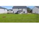 Large, grassy backyard ideal for outdoor activities and relaxation at 712 Curb Ct, Locust Grove, GA 30248