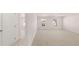 Spacious bedroom boasting soft carpeting, bright windows, and convenient access to the closet at 712 Curb Ct, Locust Grove, GA 30248