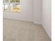 Bright bedroom featuring neutral carpet, a window offering natural light and outside view, and neutral paint at 712 Curb Ct, Locust Grove, GA 30248