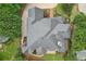 Stunning aerial view of the house, highlighting its elegant roof design and professionally landscaped yard at 8250 Saint Marlo Fairway Dr, Duluth, GA 30097
