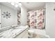 Bathroom featuring granite countertops, a shower, and stylish decor and fixtures at 8250 Saint Marlo Fairway Dr, Duluth, GA 30097