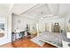 Bedroom with tray ceiling, wood floors and an adjacent office area at 8250 Saint Marlo Fairway Dr, Duluth, GA 30097