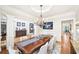 Elegant dining room featuring a large table, chandelier, and sophisticated decor at 8250 Saint Marlo Fairway Dr, Duluth, GA 30097