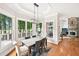 Dining room with windows overlooking the back deck at 8250 Saint Marlo Fairway Dr, Duluth, GA 30097