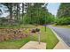 Sign marking St. Marlo Clubhouse and Golf Course, landscaped grounds and a road leading into the community at 8250 Saint Marlo Fairway Dr, Duluth, GA 30097