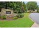 Sign marking St. Marlo Swim and Tennis, landscaped grounds and a road leading into the community at 8250 Saint Marlo Fairway Dr, Duluth, GA 30097