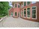 Brick home with a rounded terrace and tall, ample windows for ample sunlight at 8250 Saint Marlo Fairway Dr, Duluth, GA 30097