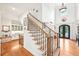 Grand foyer with soaring ceilings, staircase, and elegant details at 8250 Saint Marlo Fairway Dr, Duluth, GA 30097