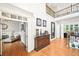 Light-filled foyer featuring hardwood floors and staircase leading to the second floor at 8250 Saint Marlo Fairway Dr, Duluth, GA 30097