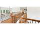 Second floor landing featuring hardwood floors and wrought iron railing at 8250 Saint Marlo Fairway Dr, Duluth, GA 30097