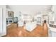 Spacious kitchen with white cabinets, double islands and a large stone fireplace at 8250 Saint Marlo Fairway Dr, Duluth, GA 30097