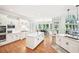 Bright kitchen with an island, breakfast nook and large windows overlooking the backyard at 8250 Saint Marlo Fairway Dr, Duluth, GA 30097