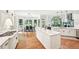 Large kitchen with breakfast nook, stainless appliances and island with quartz countertops at 8250 Saint Marlo Fairway Dr, Duluth, GA 30097