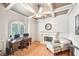 Cozy home office with fireplace, coffered ceiling, and natural light at 8250 Saint Marlo Fairway Dr, Duluth, GA 30097
