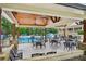 Enjoy the pool and outdoor seating with a covered area for shade and relaxation at 8250 Saint Marlo Fairway Dr, Duluth, GA 30097