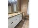 Bathroom featuring double sinks and vanity with white cabinets at 1280 Waterwood Dr, Loganville, GA 30052