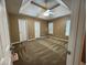 Large bedroom showcasing a modern ceiling fan and multiple doors and windows at 1280 Waterwood Dr, Loganville, GA 30052