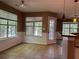 Bright breakfast nook features tiled flooring, large windows, and a view of the backyard at 1280 Waterwood Dr, Loganville, GA 30052