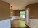 A bright dining area features an outdoor view through a sliding glass door and a modern light fixture at 1280 Waterwood Dr, Loganville, GA 30052