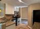 Modern kitchen with stainless steel appliances, granite counters, tile backsplash, and durable tile floors at 1280 Waterwood Dr, Loganville, GA 30052