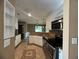 Modern kitchen with granite counters, stainless appliances, and tile floors at 1280 Waterwood Dr, Loganville, GA 30052