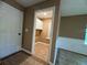 A bright laundry room features tile floors, and white cabinets offering ample storage at 1280 Waterwood Dr, Loganville, GA 30052