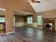 Inviting living room with a stone fireplace, new flooring, and ample natural light for a warm atmosphere at 1280 Waterwood Dr, Loganville, GA 30052