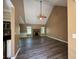 Spacious living room boasts vaulted ceilings, a fan, and a stone fireplace, perfect for cozy evenings at 1280 Waterwood Dr, Loganville, GA 30052