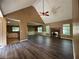 The open-concept living room features beautiful flooring, a fireplace, and abundant natural light from large windows at 1280 Waterwood Dr, Loganville, GA 30052