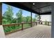 Charming deck features a railing, wood flooring, and private backyard views at 1604 Niskey Lake Rd, Atlanta, GA 30331