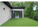 Artificial turf covered patio with steel railing, outside room with sliding glass doors at 1604 Niskey Lake Rd, Atlanta, GA 30331