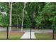 Artificial turf patio with modern steel railing and view of quiet street at 1604 Niskey Lake Rd, Atlanta, GA 30331