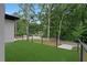 Artificial turf patio with modern steel railing and view of quiet street at 1604 Niskey Lake Rd, Atlanta, GA 30331