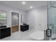 Primary bathroom featuring dual vanities, a soaking tub, and luxurious finishes at 1604 Niskey Lake Rd, Atlanta, GA 30331