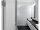 Modern bathroom with dual vessel sinks, black countertops and sleek black fixtures at 1604 Niskey Lake Rd, Atlanta, GA 30331
