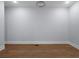 Bright bedroom with hardwood floors, modern ceiling fan, and neutral wall paint at 1604 Niskey Lake Rd, Atlanta, GA 30331