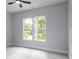 Bedroom with natural light provided by windows and a ceiling fan at 1604 Niskey Lake Rd, Atlanta, GA 30331
