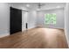Spacious bedroom featuring a sliding barn door and abundant natural light at 1604 Niskey Lake Rd, Atlanta, GA 30331