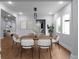 This dining room features a sleek table, modern chairs, and large windows, creating a bright and welcoming space at 1604 Niskey Lake Rd, Atlanta, GA 30331