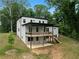 Modern two-story home featuring a spacious deck, and a contemporary design at 1604 Niskey Lake Rd, Atlanta, GA 30331