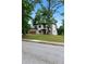Modern two-story home showcasing front yard, balcony, and modern architectural design at 1604 Niskey Lake Rd, Atlanta, GA 30331