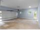 Clean, bright two-car garage with white walls and concrete floor at 1604 Niskey Lake Rd, Atlanta, GA 30331