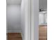 Hallway leading to living space with hardwood flooring and neutral paint at 1604 Niskey Lake Rd, Atlanta, GA 30331