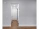Bright hallway with hardwood floors leading to various rooms in the house at 1604 Niskey Lake Rd, Atlanta, GA 30331