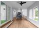 Open-concept hallway with wet bar, hardwood floors, and contemporary design at 1604 Niskey Lake Rd, Atlanta, GA 30331